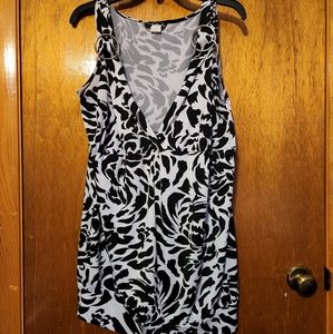Tank style blouse with banded bottom with silver ring accents on straps
